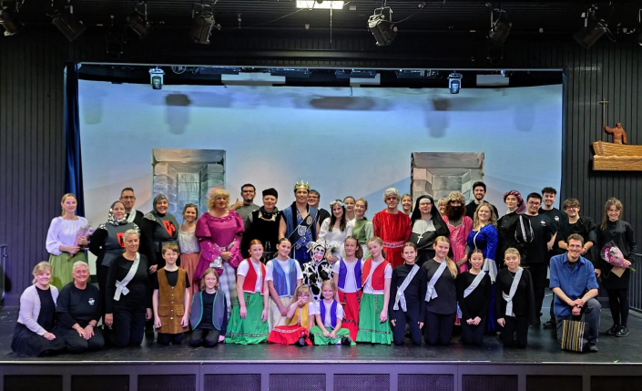 the cast and crew of "Robin Hood" on stage in costume