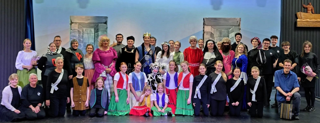 the cast and crew of "Robin Hood" on stage in costume