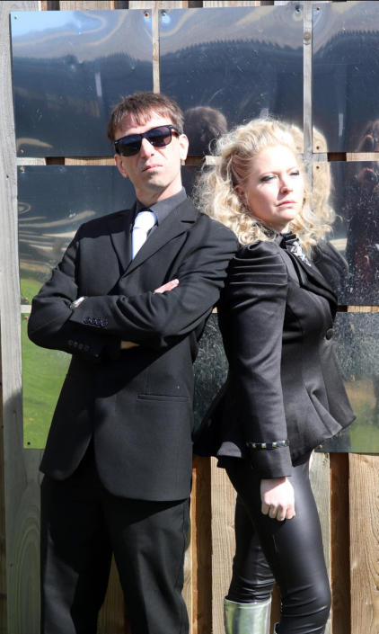 the cast of "We Will Rock You" in costume for a promotional photo-shoot.