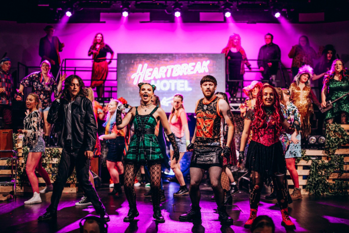 a scene from "We Will Rock You" photographed live on stage