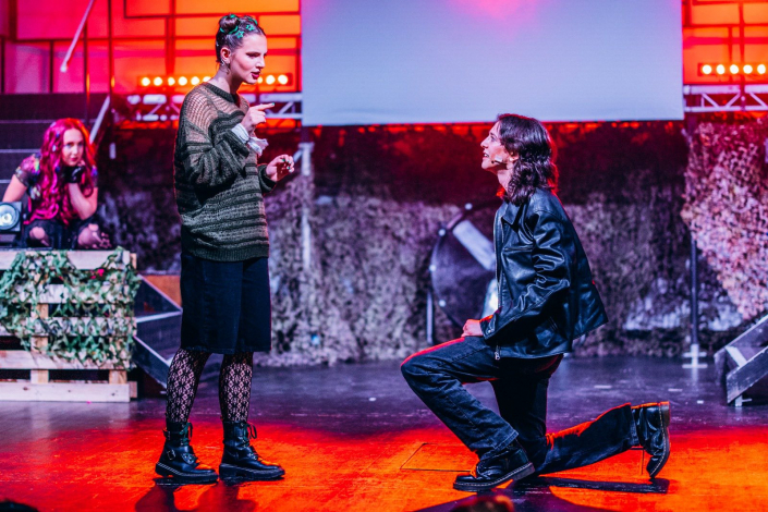 a scene from "We Will Rock You" photographed live on stage