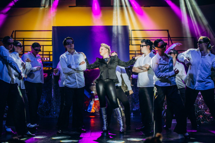 a scene from "We Will Rock You" photographed live on stage