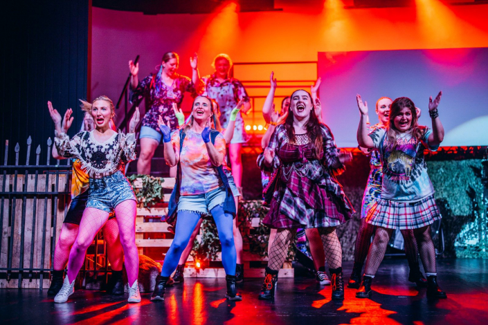 a scene from "We Will Rock You" photographed live on stage
