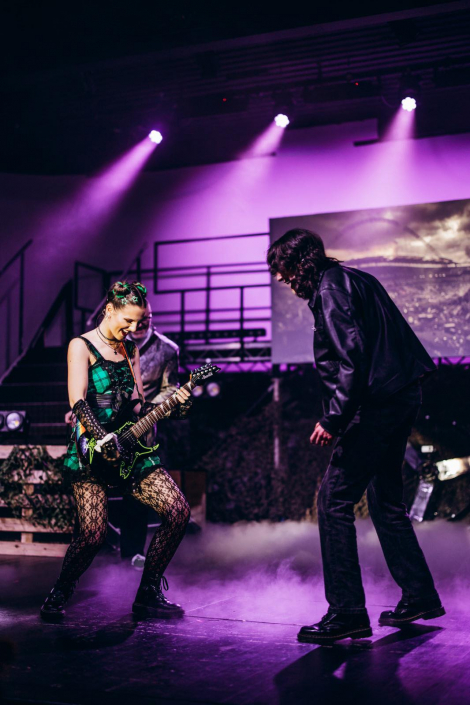 a scene from "We Will Rock You" photographed live on stage