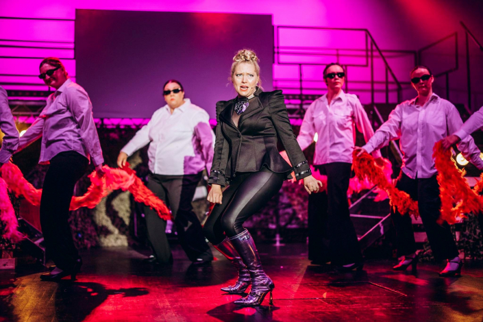 a scene from "We Will Rock You" photographed live on stage
