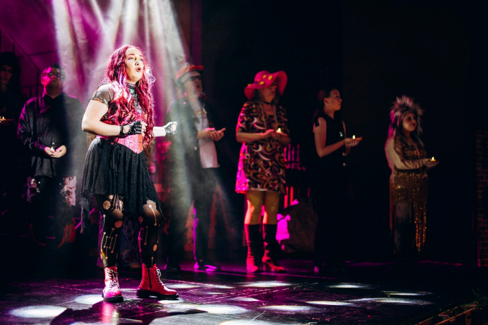 a scene from "We Will Rock You" photographed live on stage