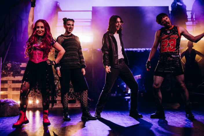 a scene from "We Will Rock You" photographed live on stage