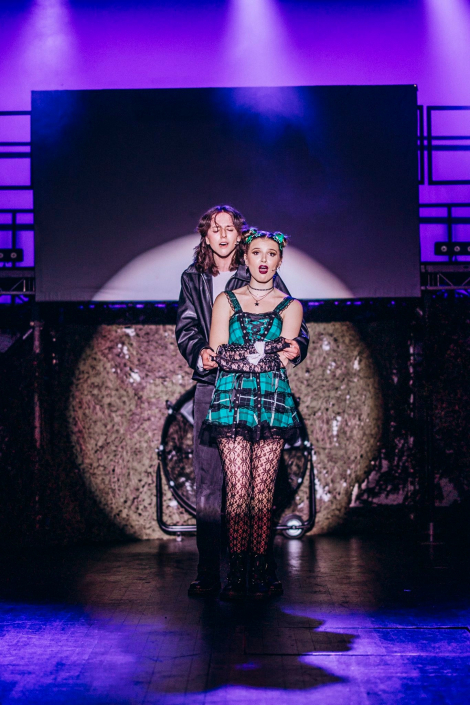 a scene from "We Will Rock You" photographed live on stage