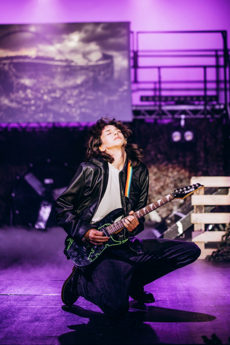 a scene from "We Will Rock You" photographed live on stage