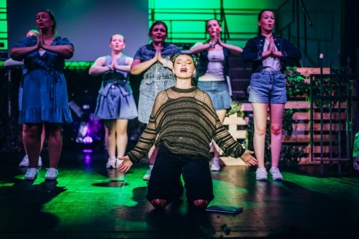 a scene from "We Will Rock You" photographed live on stage