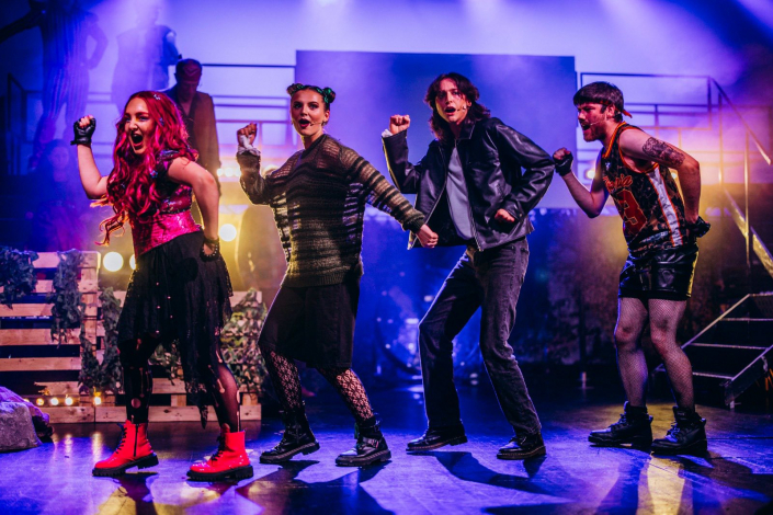 a scene from "We Will Rock You" photographed live on stage