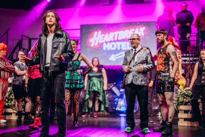 a scene from "We Will Rock You" photographed live on stage