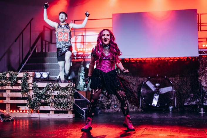 a scene from "We Will Rock You" photographed live on stage